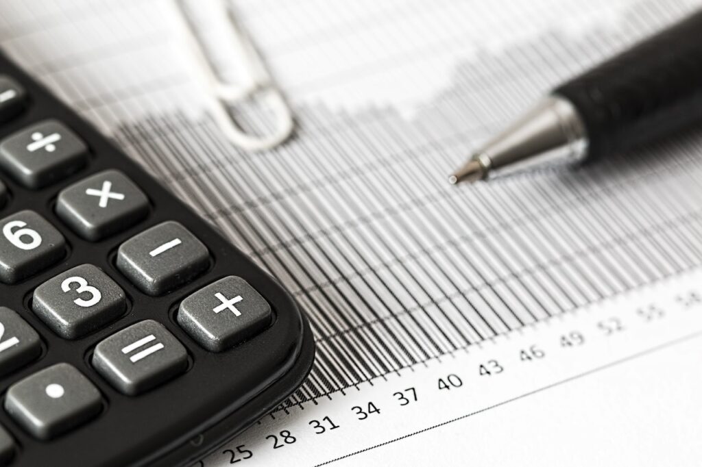 An image showing a person calculating their salary from a limited company, demonstrating how to pay yourself from a limited company effectively.